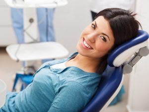woman visits orthodontist to commence treatment in adult orthodontics