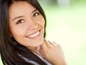 woman smiles after having adult orthodontics treatment