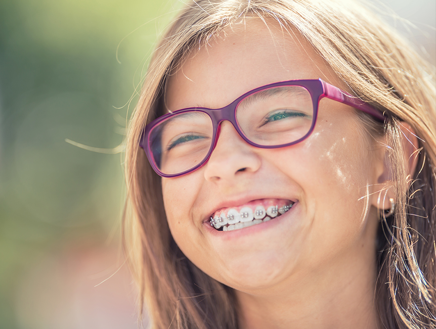 girls smiles with suresmile system braces