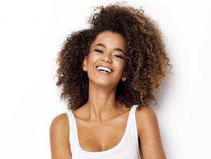 Woman happy over SureSmile pros and cons.