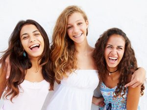 Group of teens after ceramic braces reviews